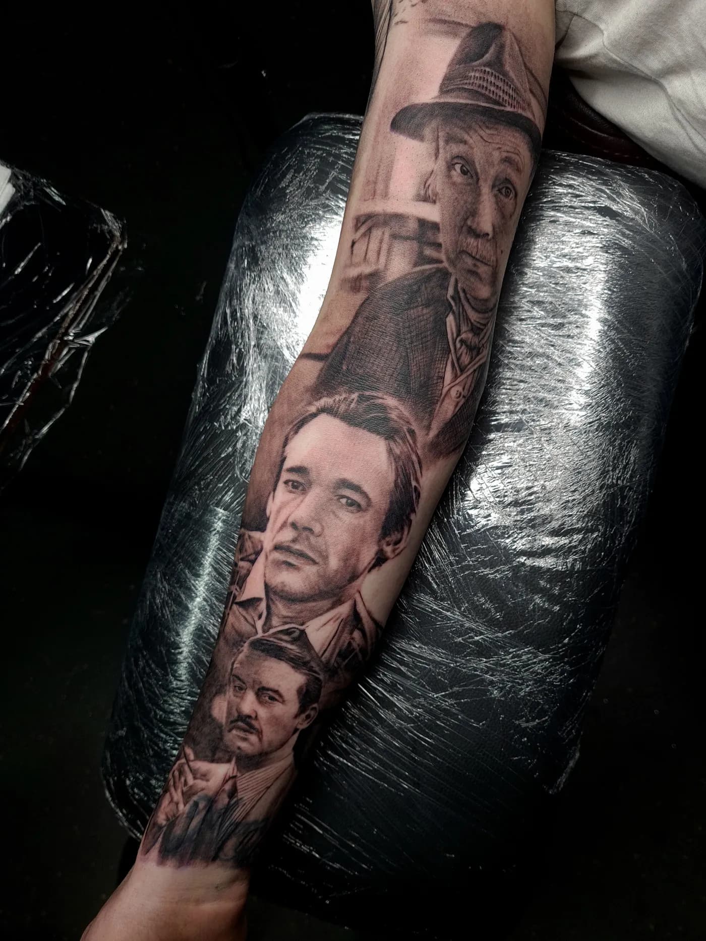 Only Fools and Horses tattoo sleeve, inner arm — black and grey realism portraits of Grandad in his trilby hat, Trigger and Boycie with his cigar, by Liam Rebel Tattoos Sheffield