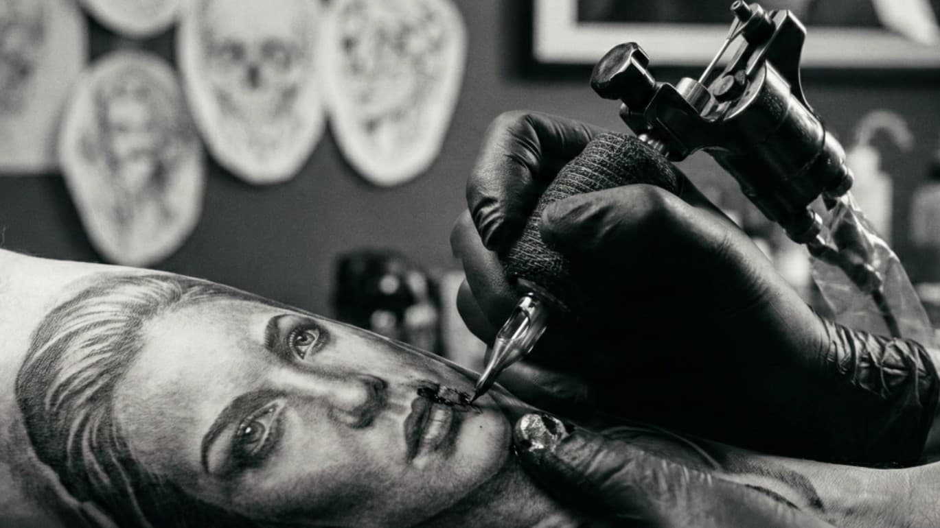 Services banner - black and grey realism tattoo studio