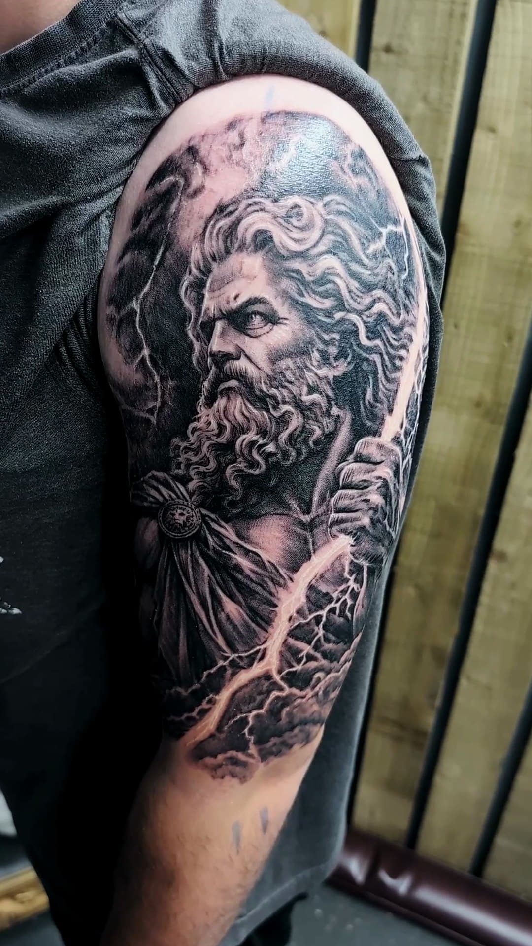 Zeus with lightning bolt upper arm tattoo, 6-hour session