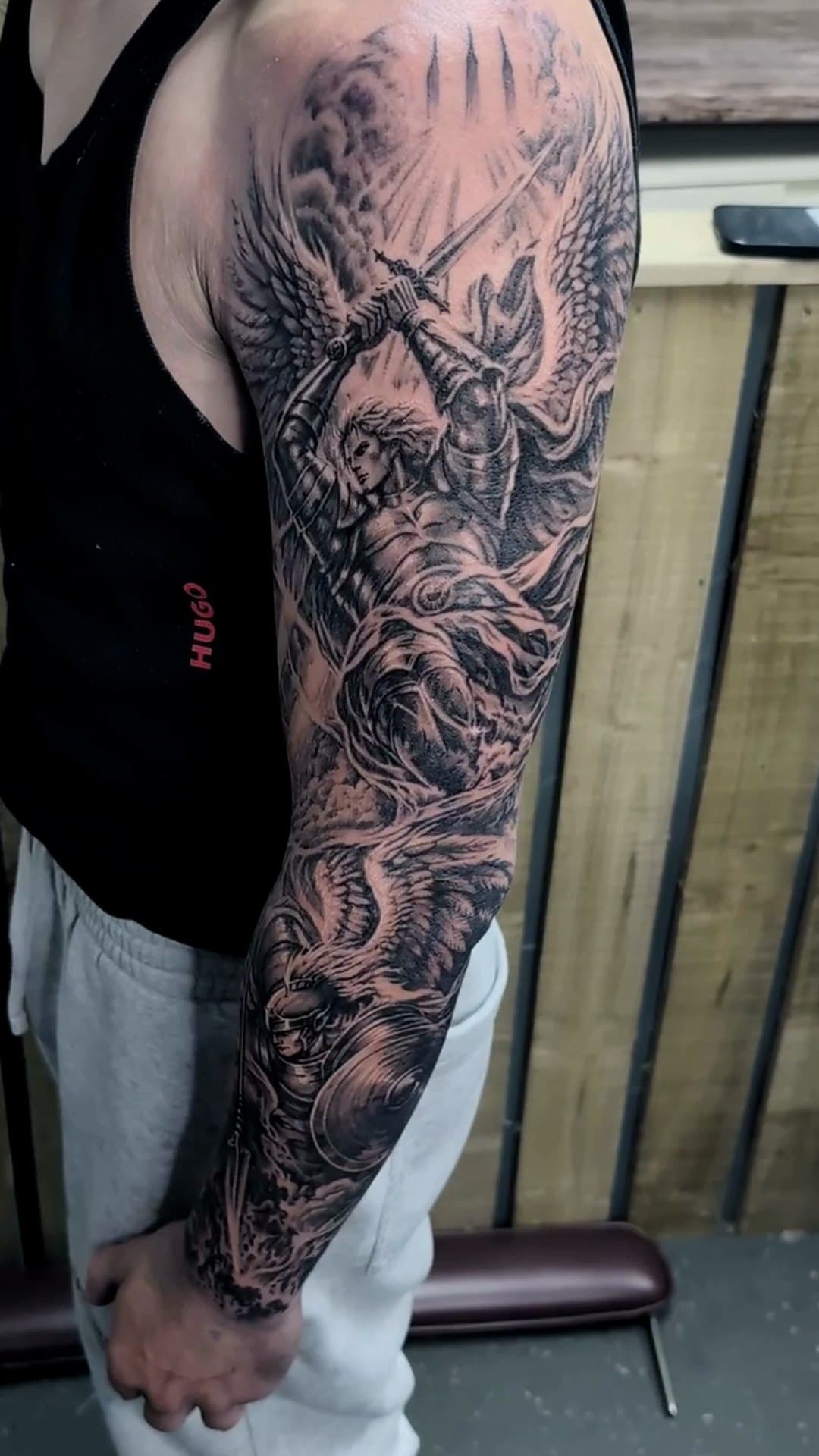 Heaven vs hell black and grey sleeve tattoo, 8-hour session